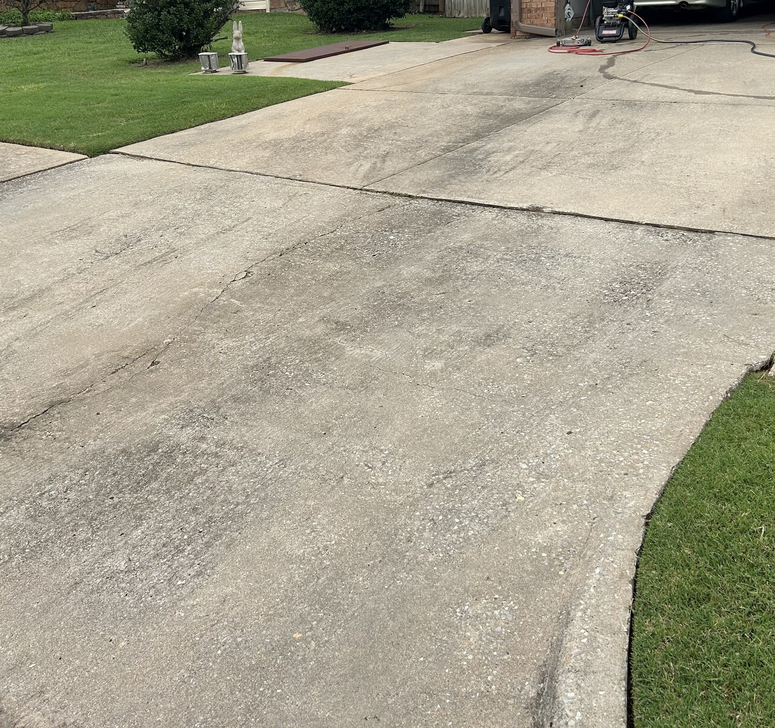 Driveway before pressure washing